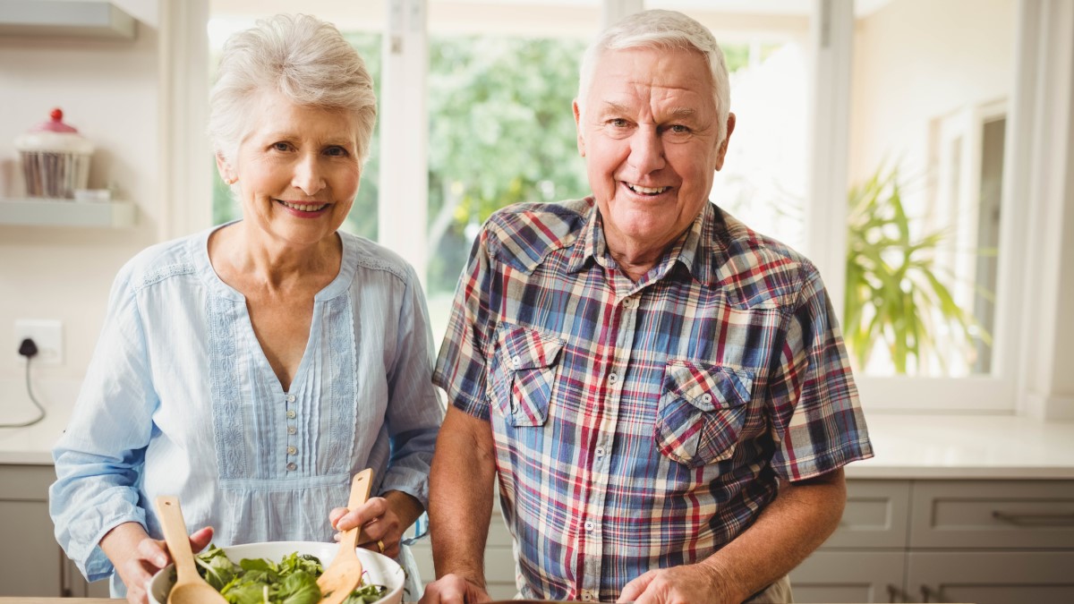 couple salad a man and a woman making a salad