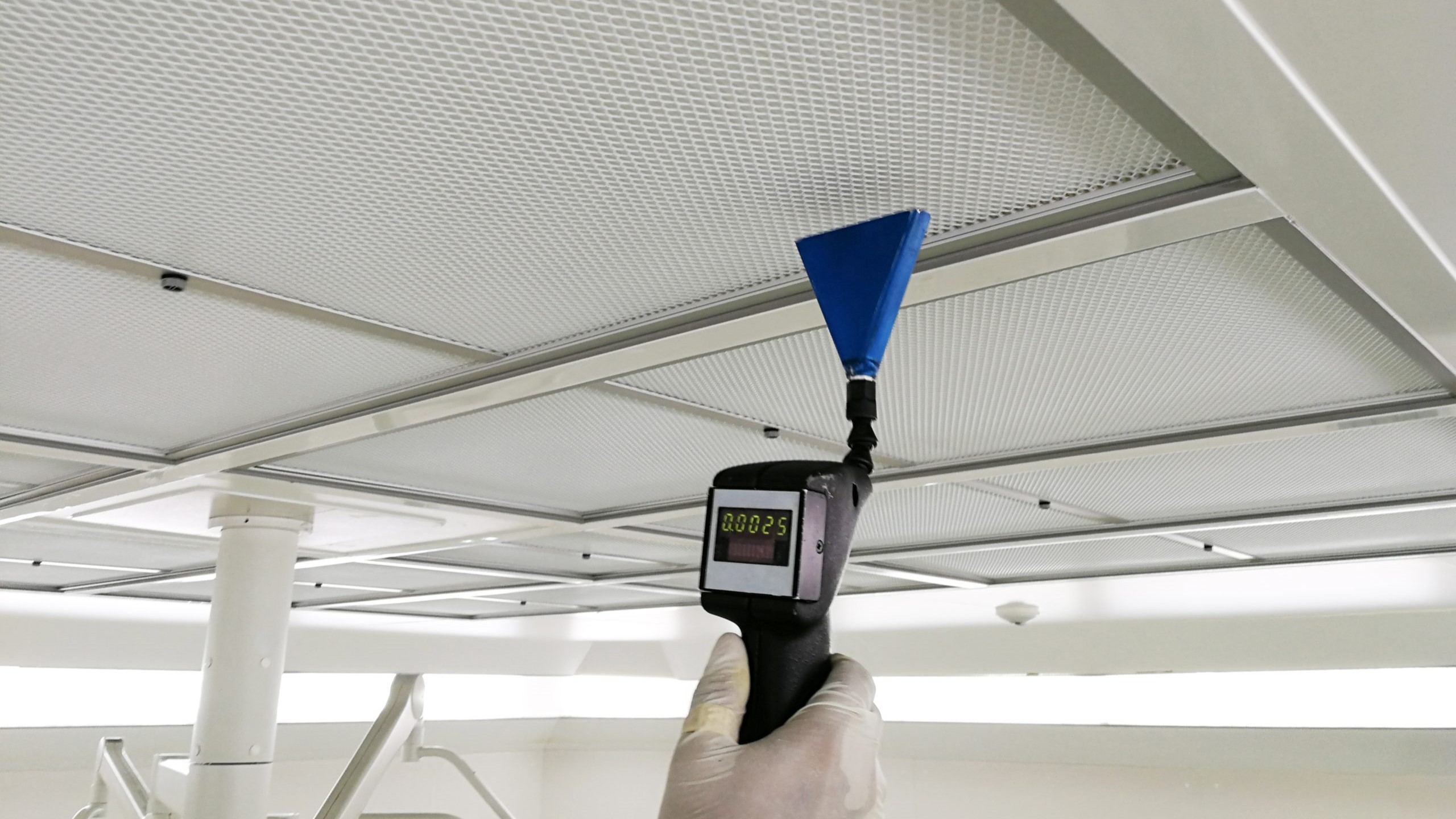 Ventilation-HEPA-Check Hand checks a leak in a HEPA filter.