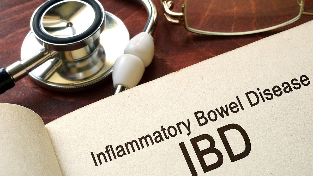 Book on a table open to a page that reads &ldquo;Inflammatory Bowel Disease IBD.&rdquo;