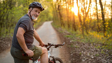 Senior man on his mountain bike outdoors Senior man on his mountain bike outdoors